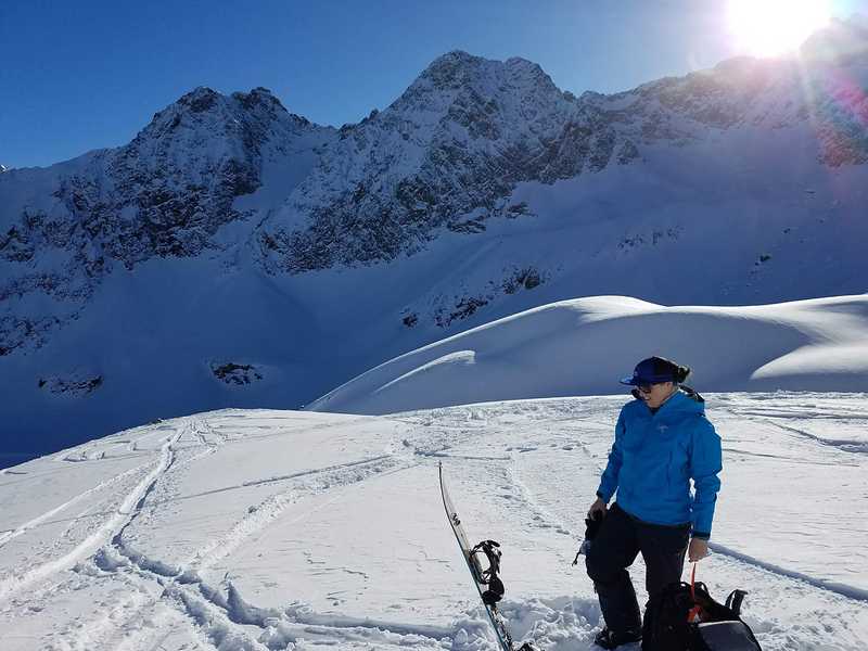 Me transitioning my splitboard after a large snowy climb in Austria